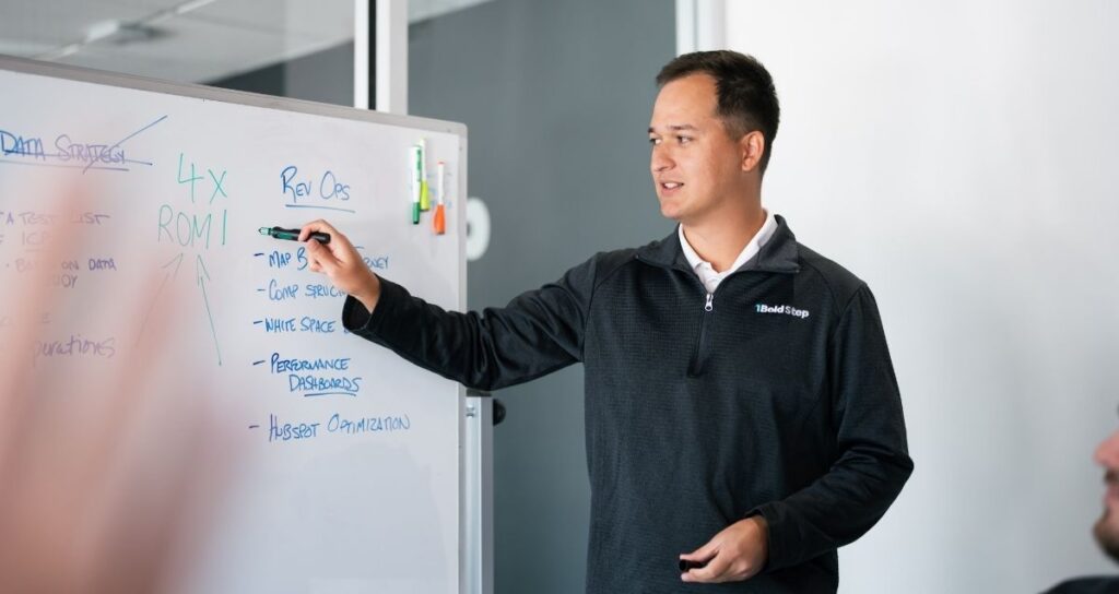 1BoldStep leader presenting at a whiteboard with marker