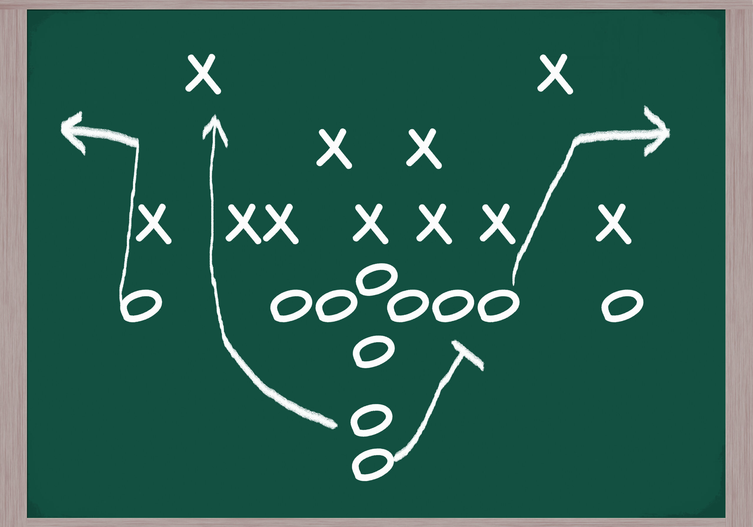 The image shows a diagram of a football play drawn on a chalkboard. The "X"s represent the defensive players, and the "O"s represent the offensive players. The arrows indicate the planned routes and movements of the players.