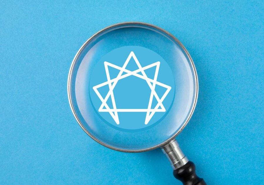 enneagram logo under a magnifying glass