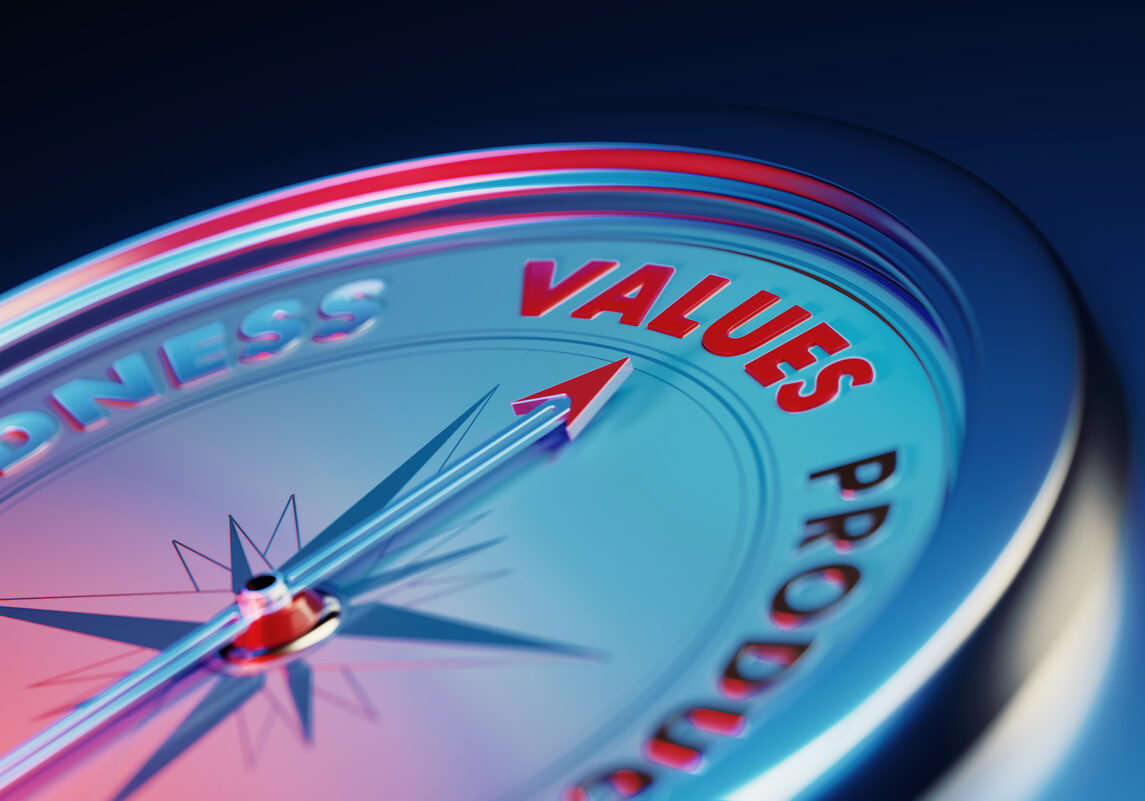 Arrow of the compass is pointing the values word over dark blue metallic background. Horizontal composition with copy space. Values concept.