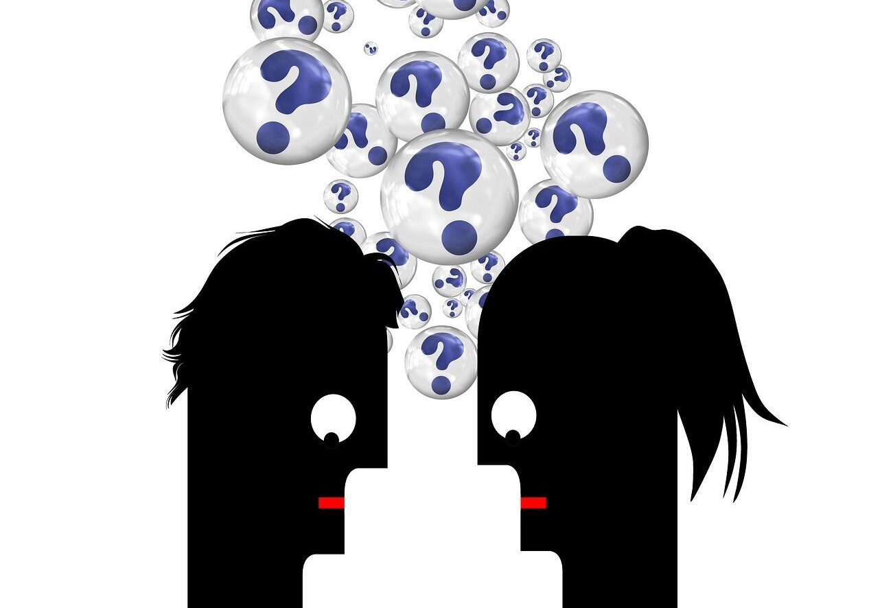 cartoon graphic of two people looking confused with bubbles full of question marks over their heads