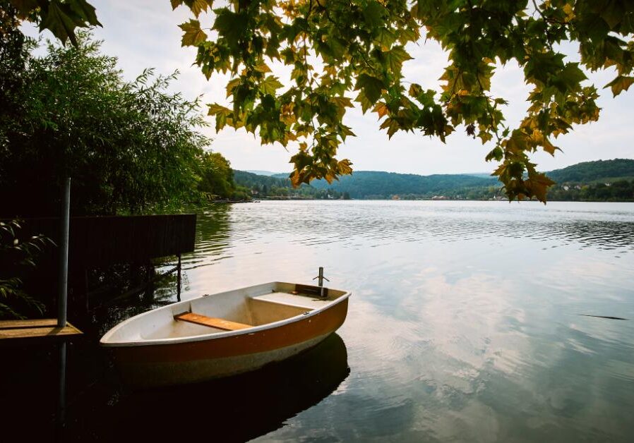 a peaceful lake with a boat