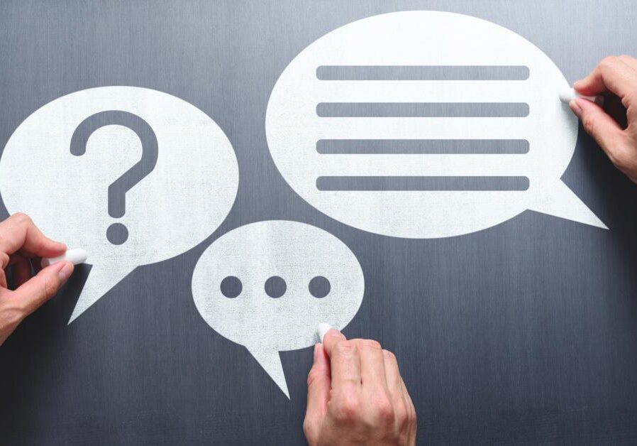 Hands drawing speech bubbles